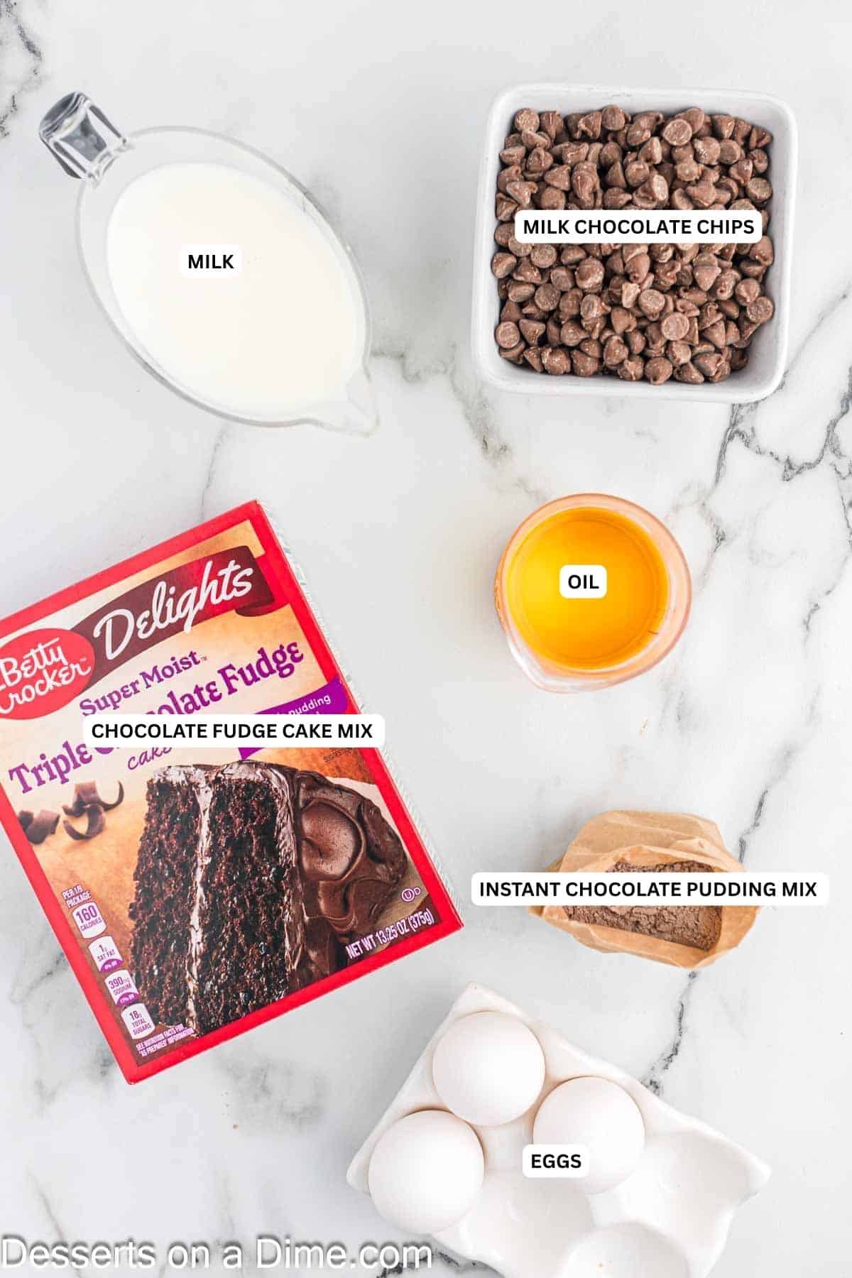 Ingredients for recipe: milk, milk chocolate chips, oil, chocolate fudge cake mix, instant chocolate pudding mix and eggs.