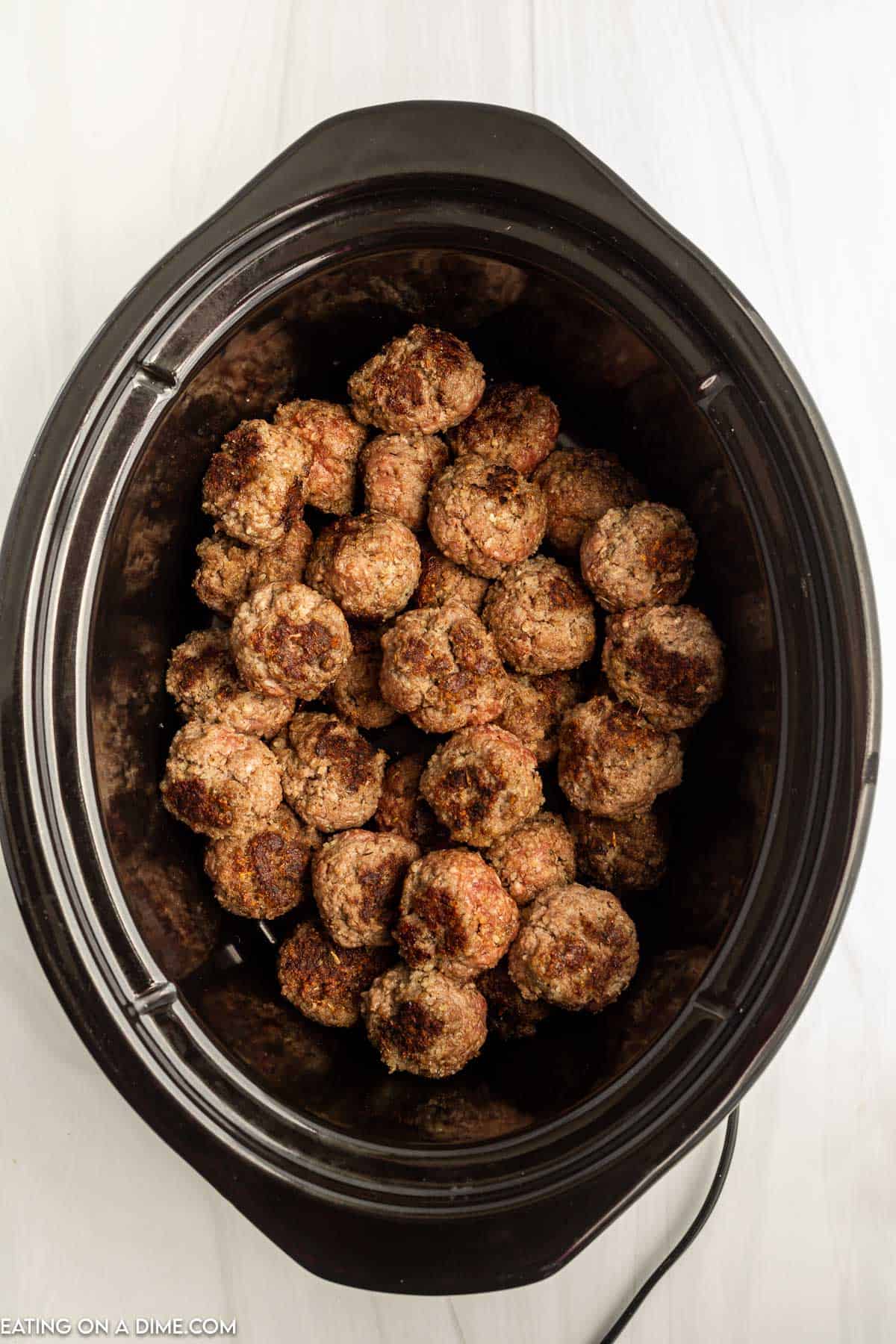 Cooked meat balls in a slow cooker