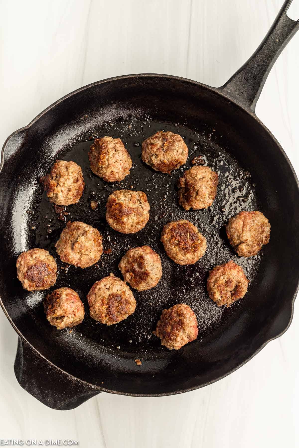 Cooking meatballs in a cast iron skillet