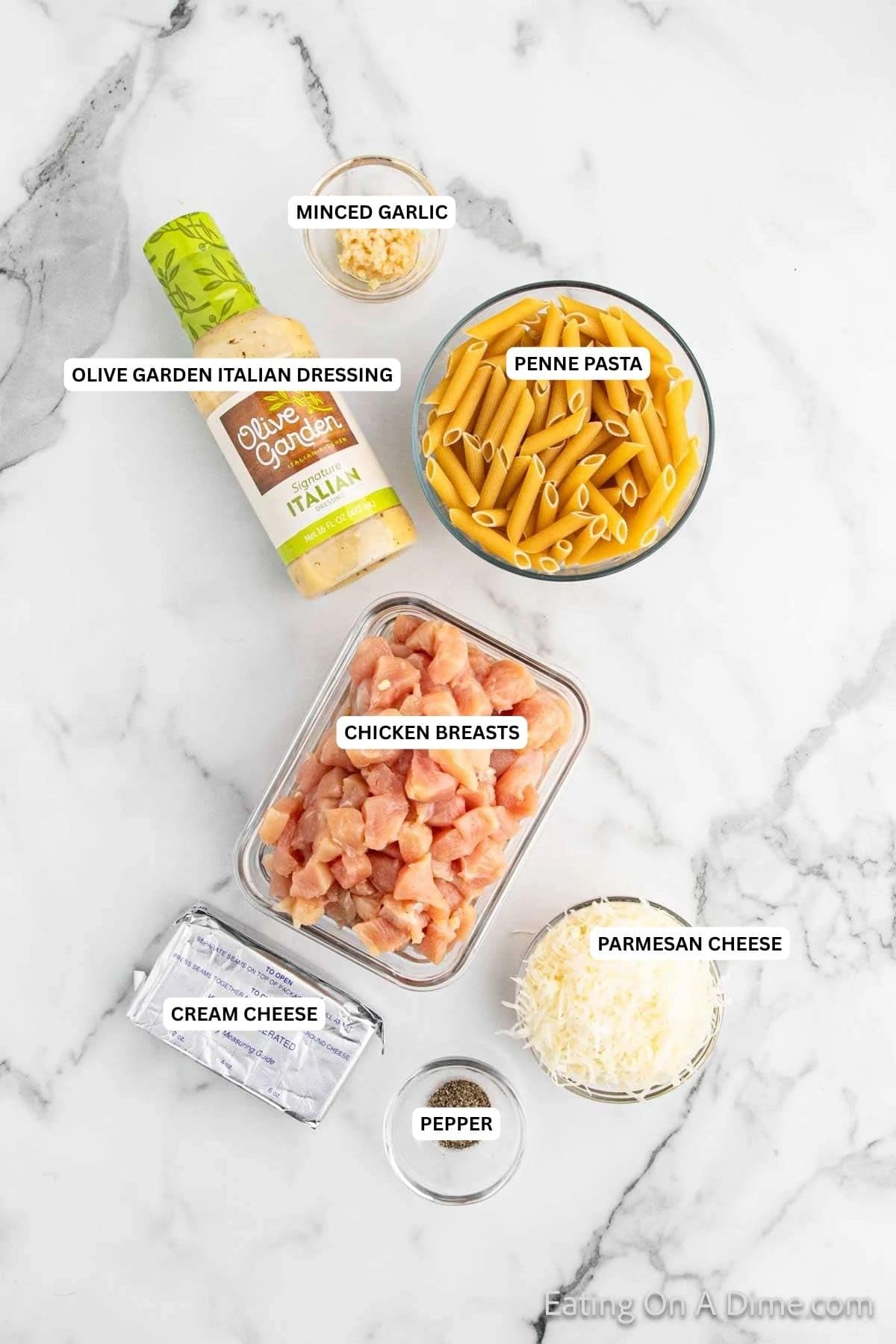 Ingredients for recipe: minced garlic, Olive Garden Italian Dressing, penne pasta, chicken breasts, Parmesan cheese, cream cheese and pepper.