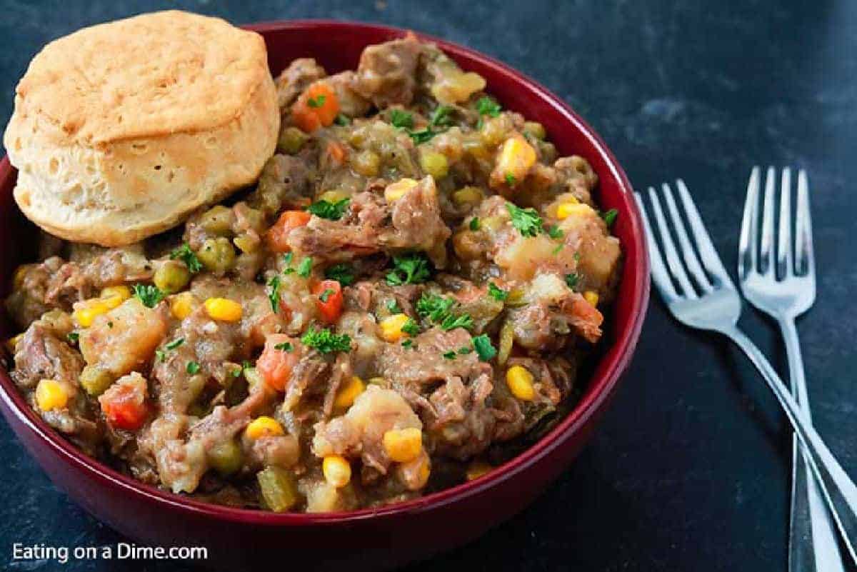 Beef Pot Pie in a bowl topped with a biscuit