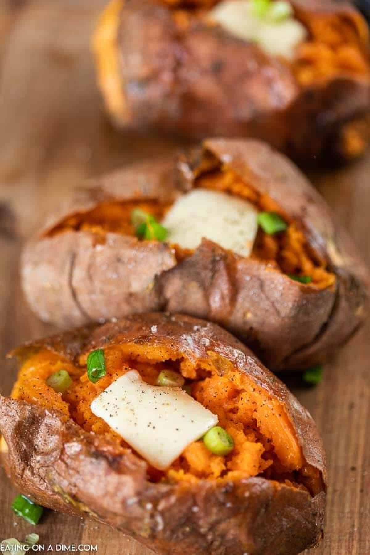 Close up image of sweet potatoes topped with butter