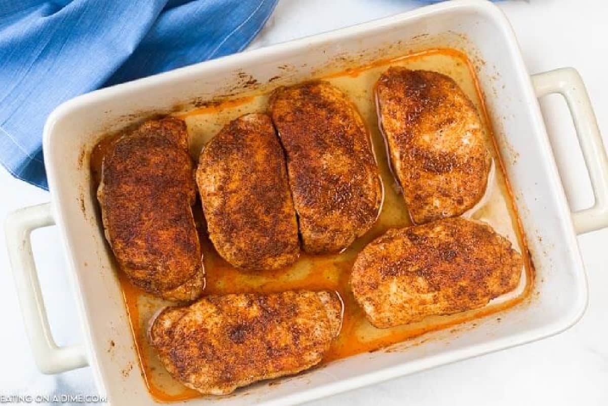 white baking dish with pork chops