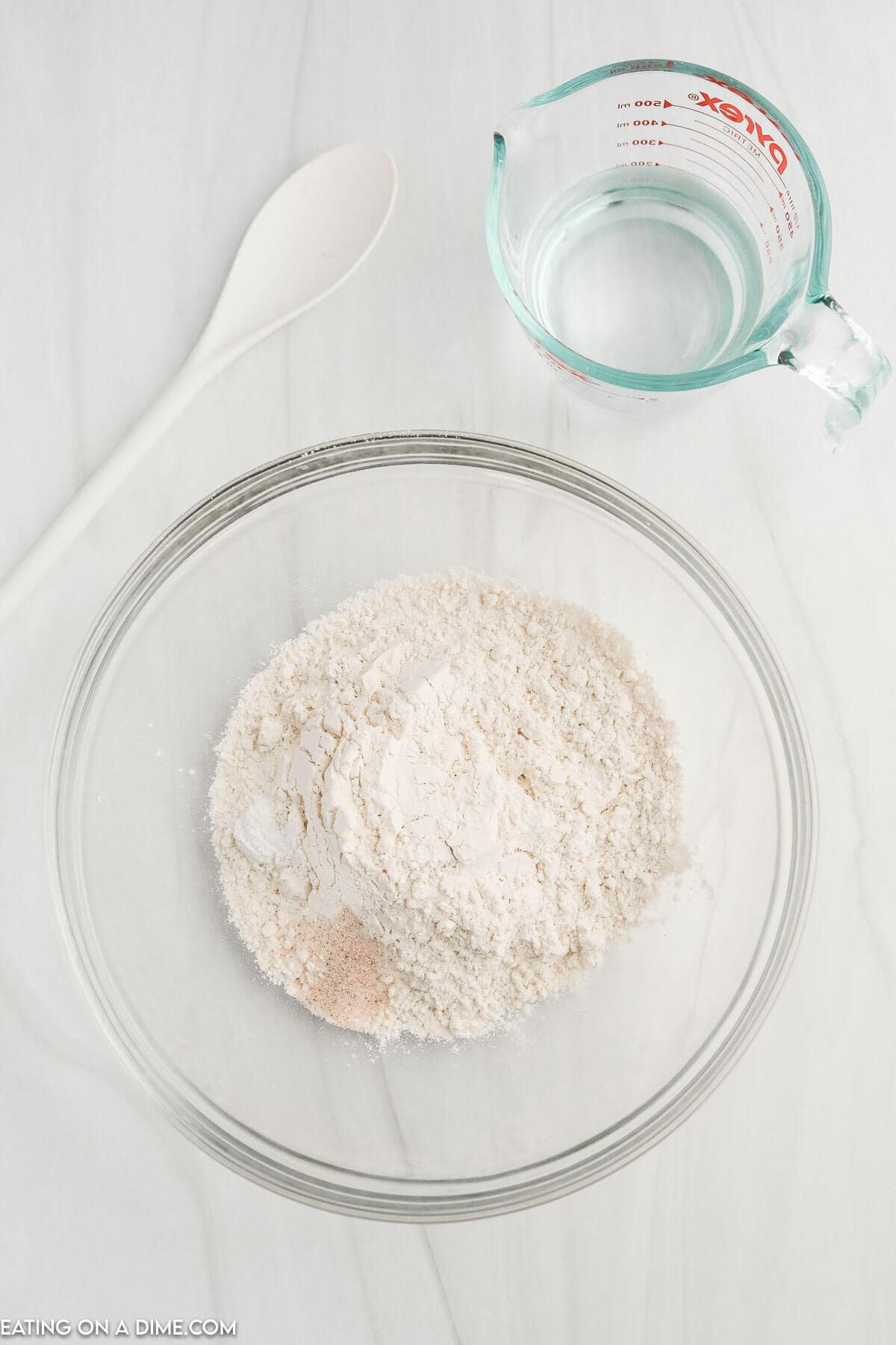 Combining the salt, flour, and baking powder together in a bowl 