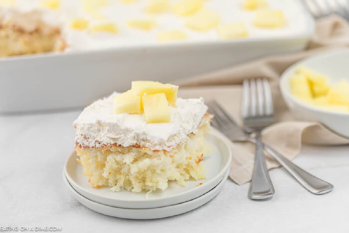 angel food cake with pineapple on a plate with pineapple cake in a baking pan