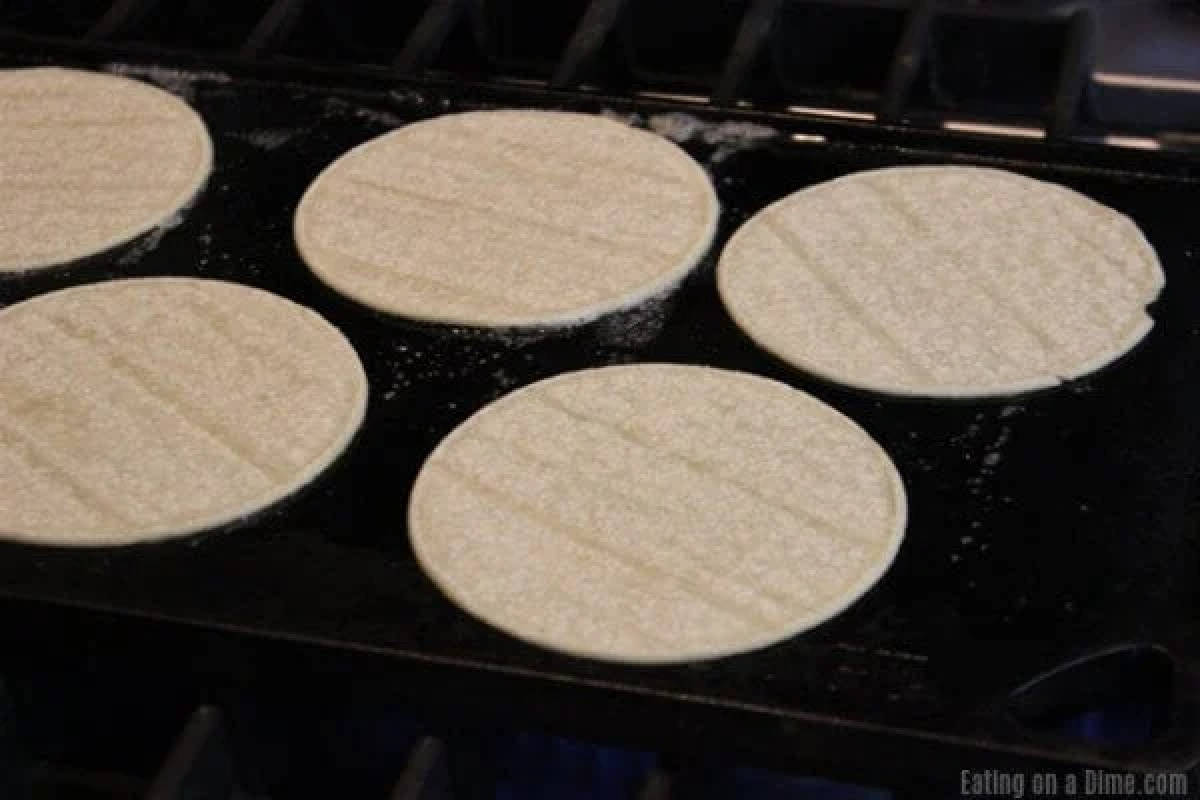 Heating corn tortillas on a griddle