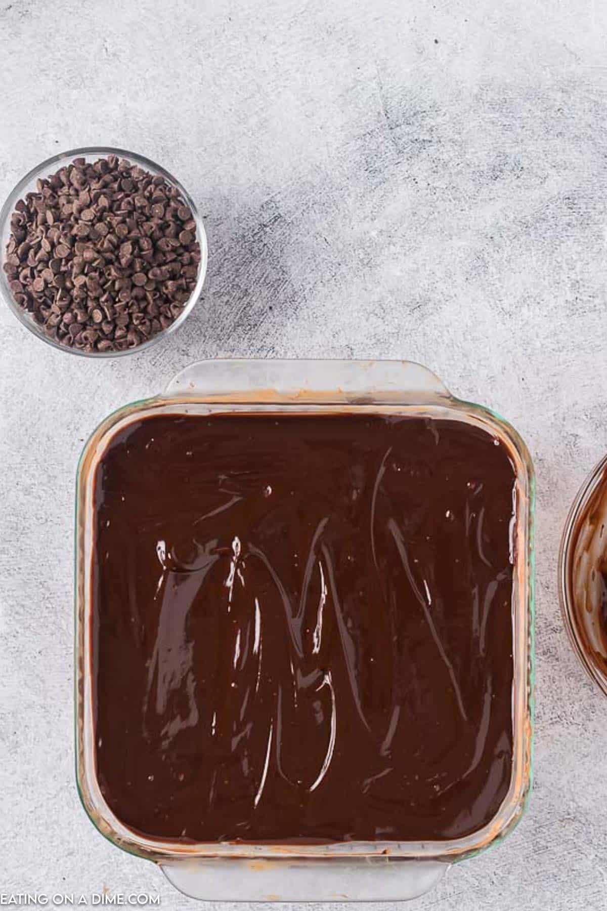 Chocolate ganache layer placed in the baking dish