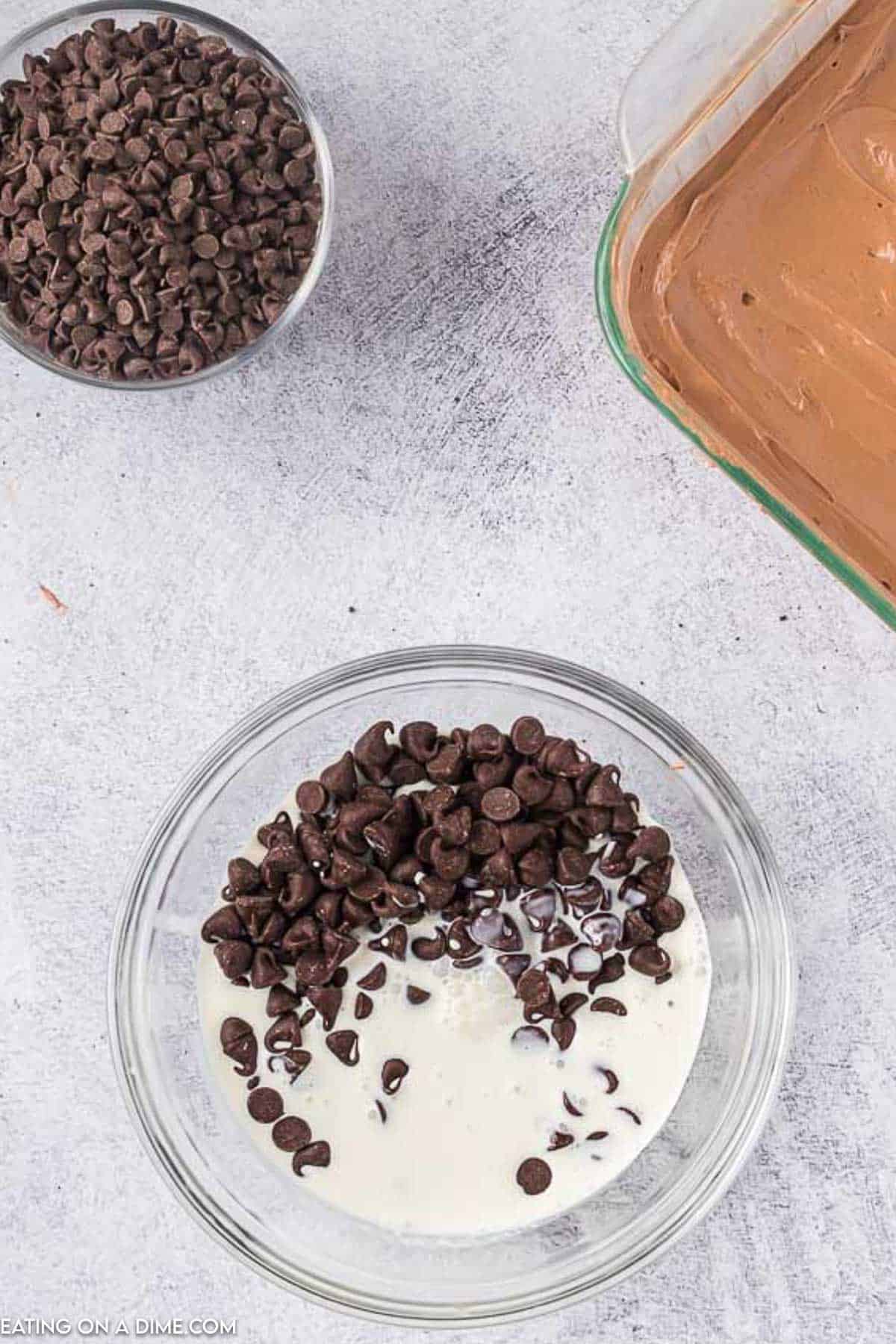 Chocolate chips and milk in a bowl