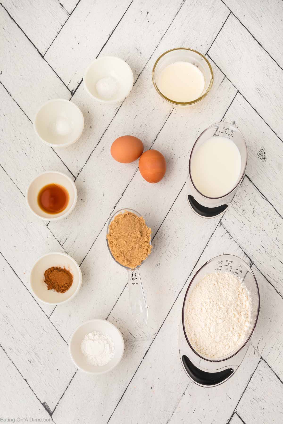 Coffee Cake Muffins Ingredients - Flour, brown sugar, baking powder, baking soda, salt, cinnamon, milk, butter, eggs, vanilla extract, powdered sugar