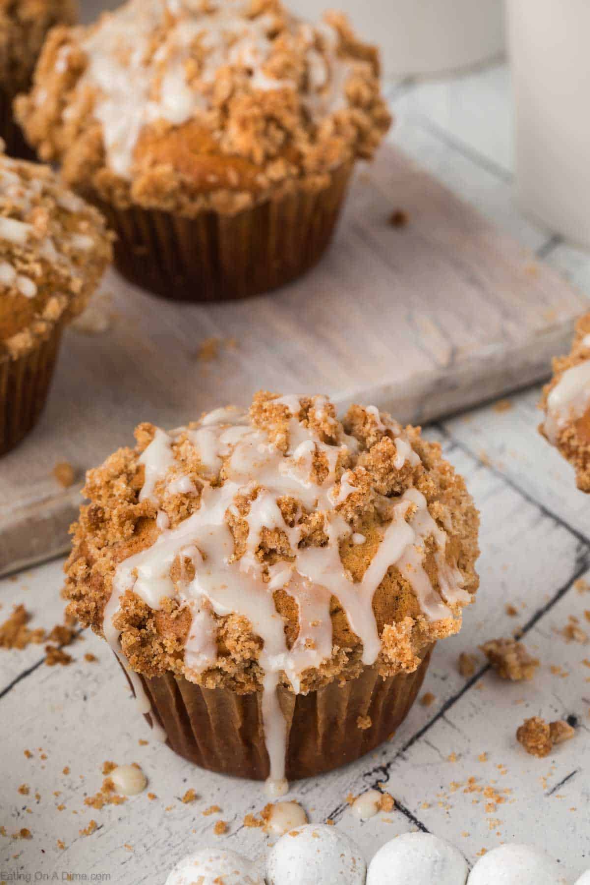 Coffee Cake Muffins topped with crumble toppings and glaze