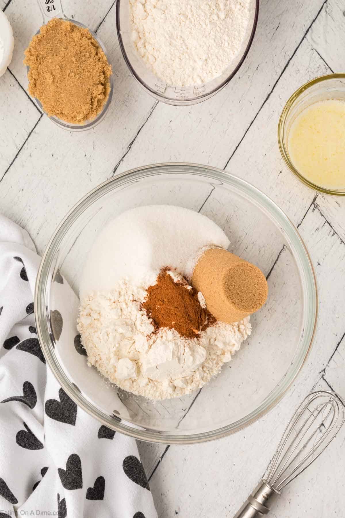 Flour, sugar, brown sugar, and cinnamon in a bowl