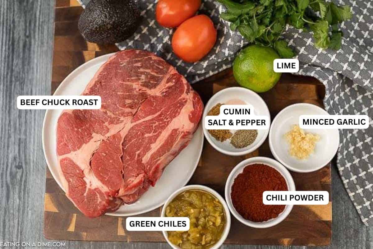 Ingredients for recipe: beef chuck roast, green chiles, garlic, chili powder, cumin, salt, pepper, lime.