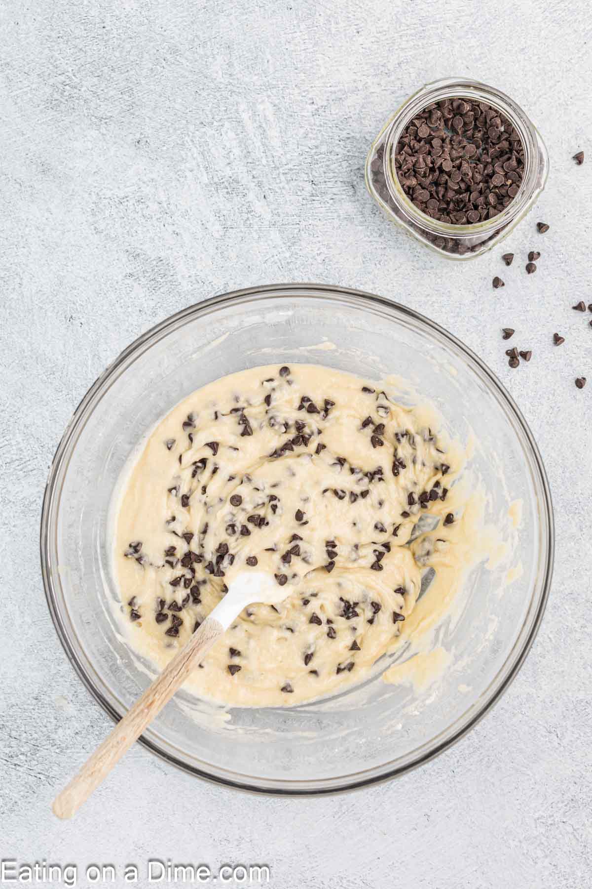 Mixing in the chocolate chips in th muffin batter