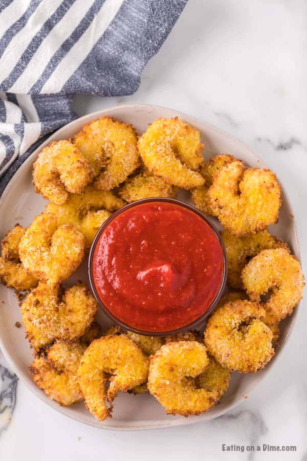 fried shrimp on plate with cocktail sauce