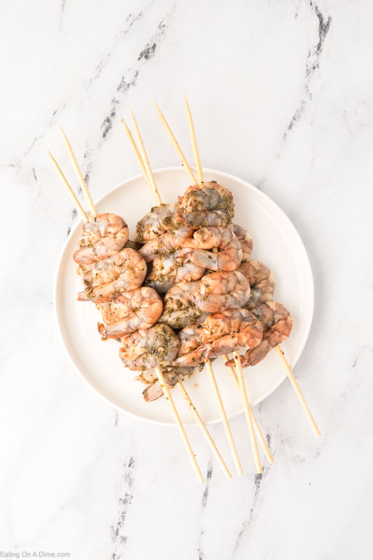 Marinated shrimp skewers on a plate