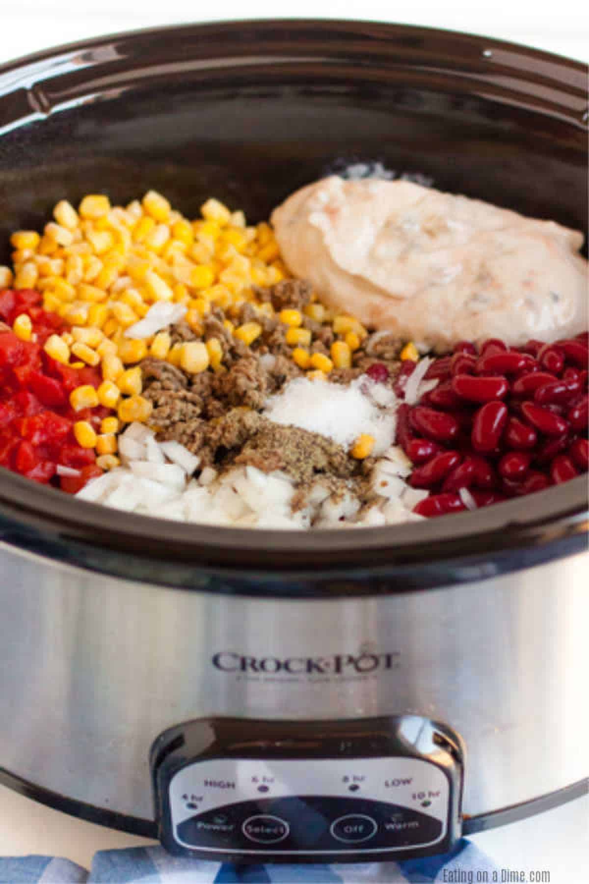 Crockpot Cowboy Casserole Recipe has everything you need for a tasty meal. Packed with flavorful ground beef, hearty beans, cheese and more! 