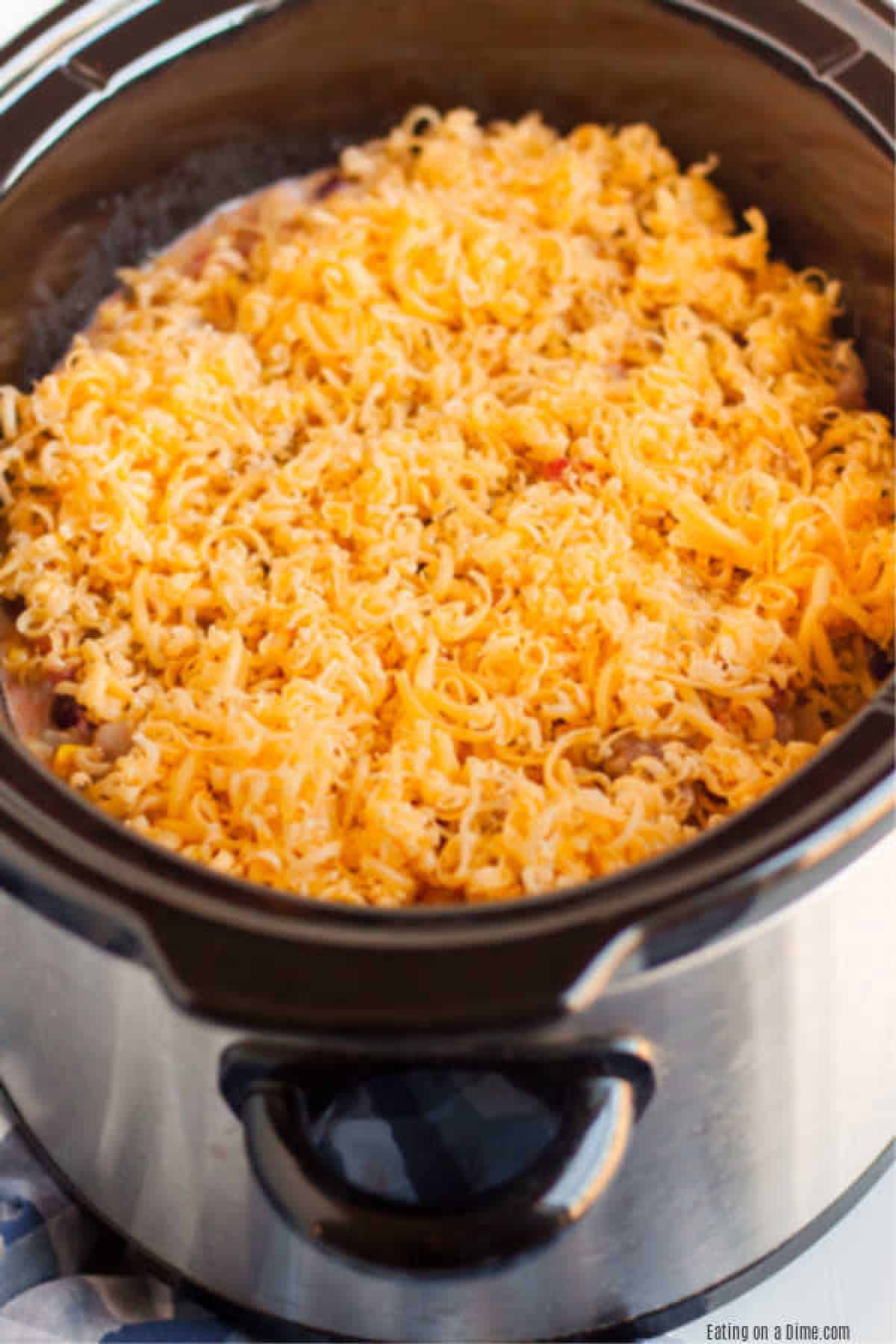 Crockpot Cowboy Casserole Recipe has everything you need for a tasty meal. Packed with flavorful ground beef, hearty beans, cheese and more! 