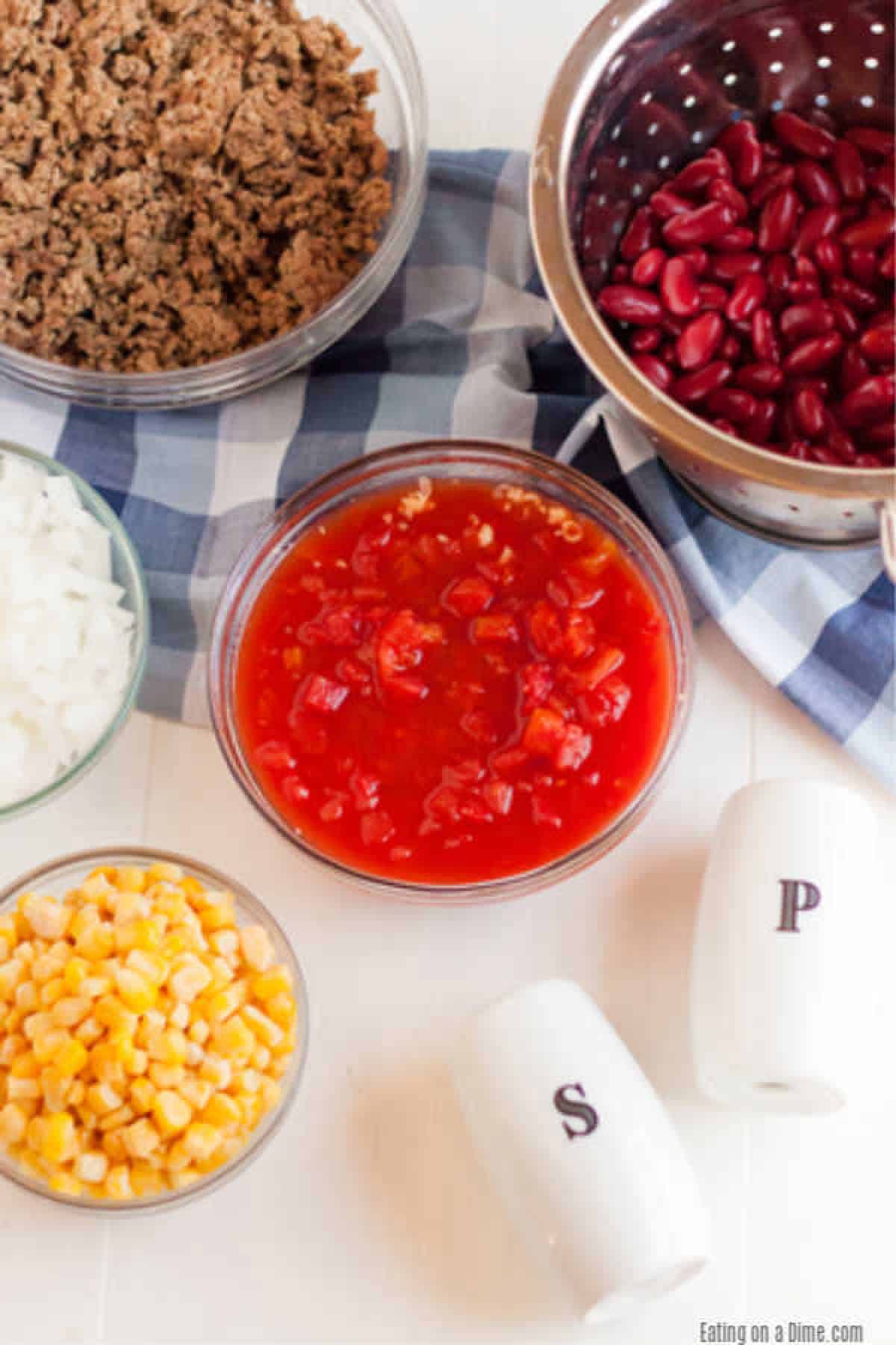 Crockpot Cowboy Casserole Recipe has everything you need for a tasty meal. Packed with flavorful ground beef, hearty beans, cheese and more! 