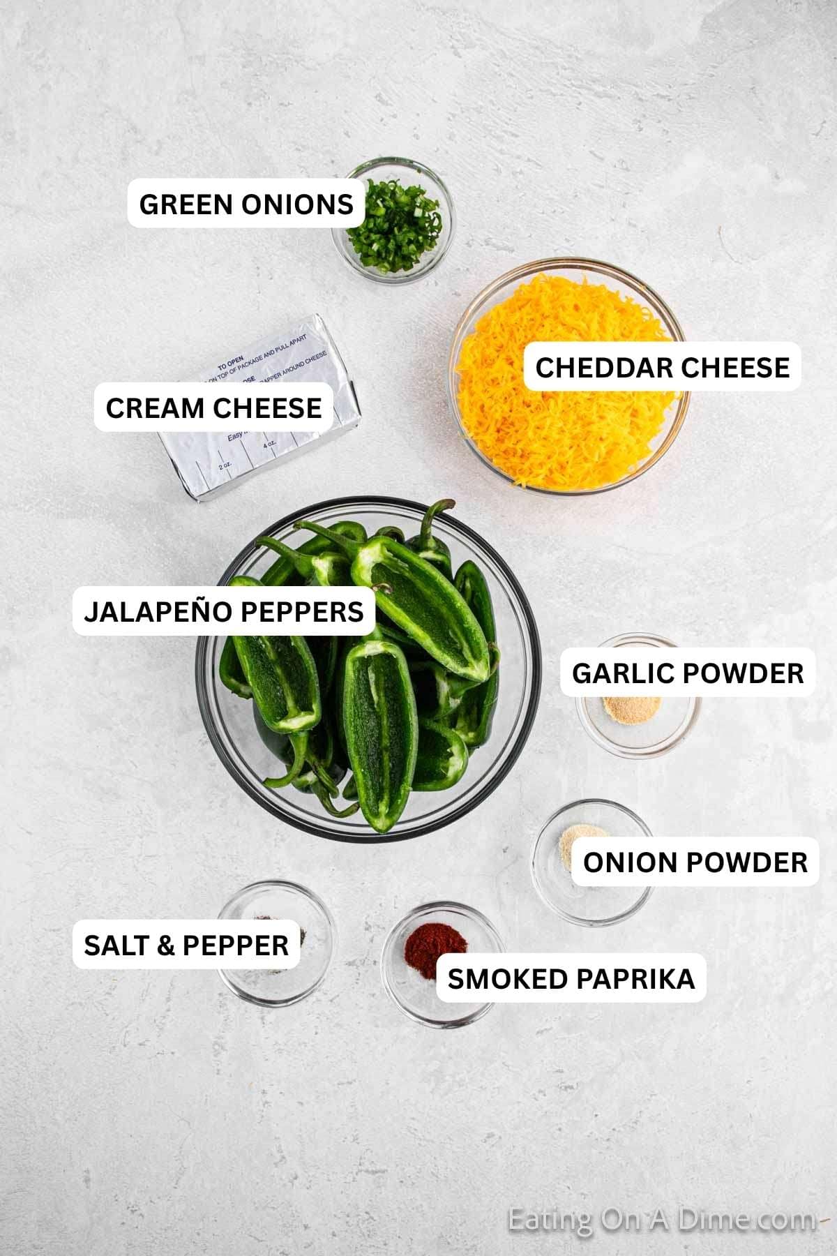 Ingredients for recipe: smoked paprika, onion powder, salt, pepper, jalapeno peppers, cheddar cheese, green onions and cream cheese,