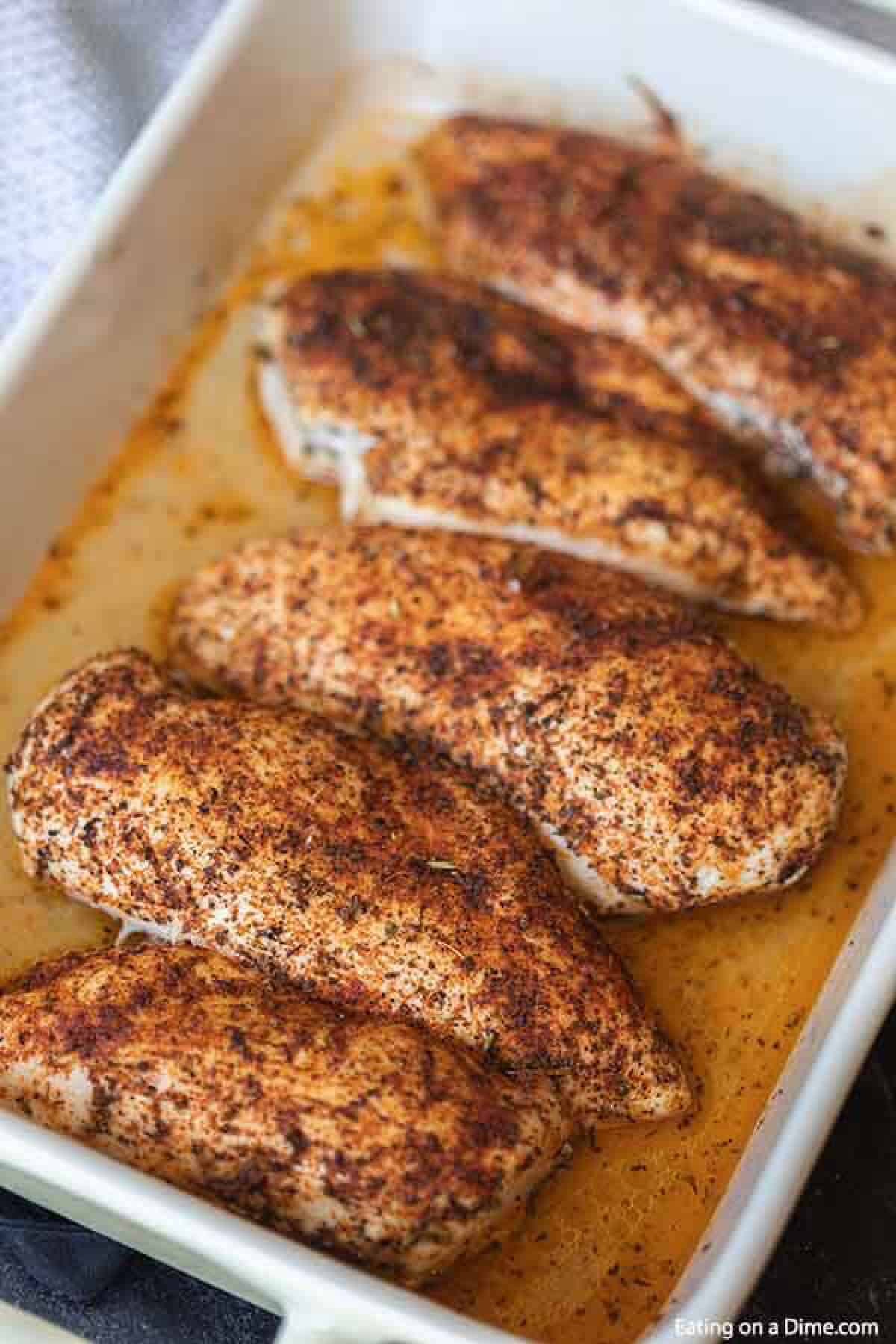 Baked seasoned chicken breast in a baking dish