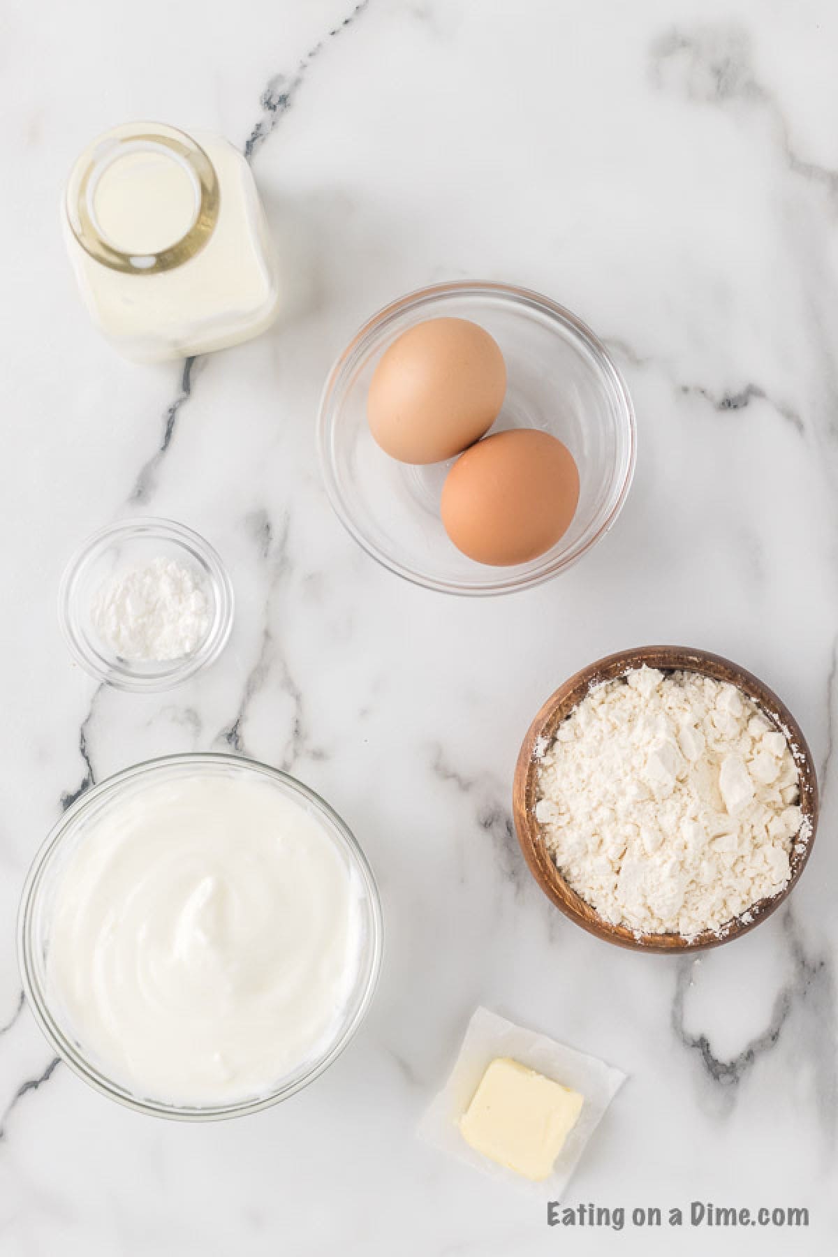 Ingredients, Greek Yogurt, butter, flour, eggs, baking powder, and milk
