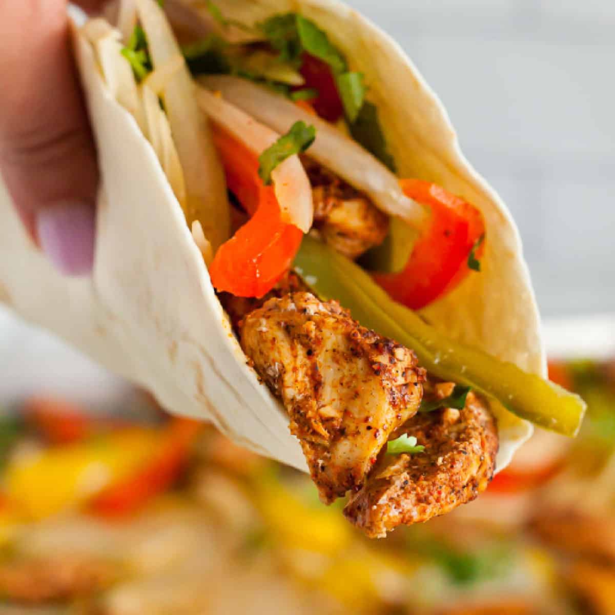 Sheet Pan Chicken Fajitas only takes a few ingredients and less than 25 minutes. Enjoy this delicious chicken mixture with tortillas or serve it alone.