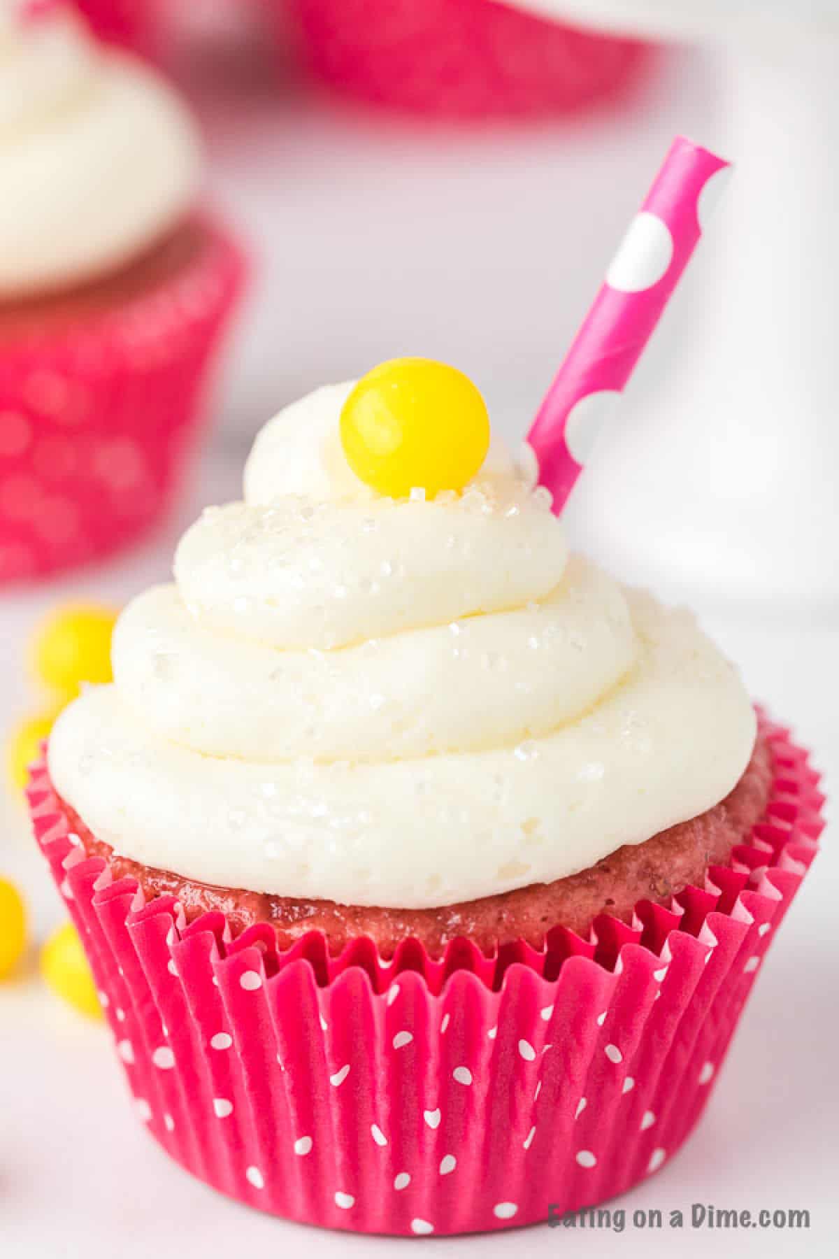 Get ready for a burst of flavor when you make Strawberry Lemonade Cupcakes. The combination of real strawberries and lemonade taste amazing. Close up image of Strawberry Lemonade Cupcake