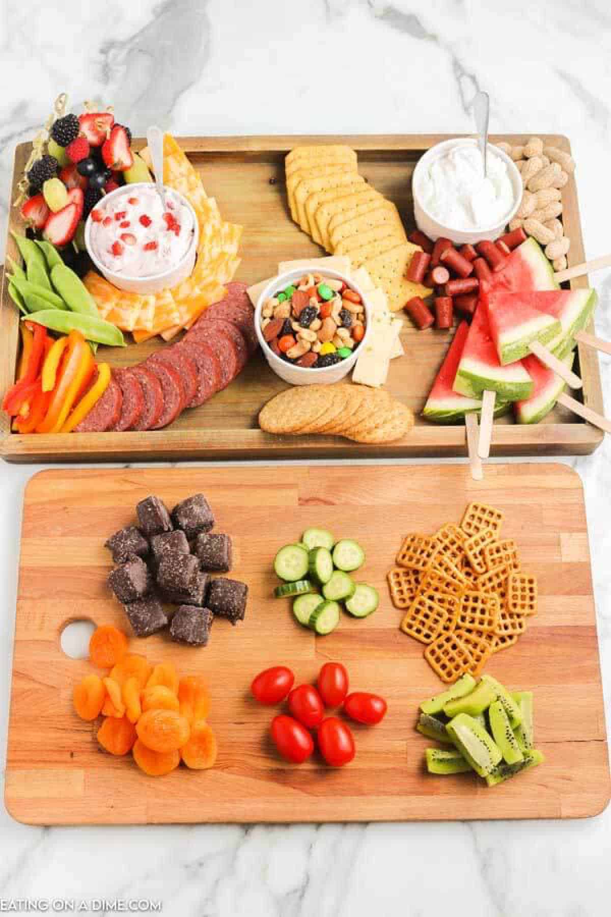 photo of making the charcuterie board with placing the larger items first.