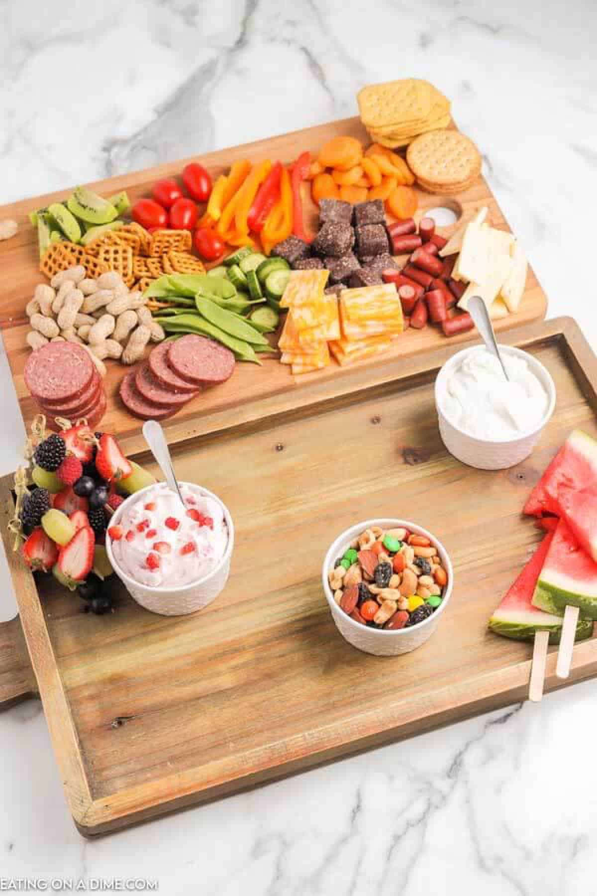photo of making the charcuterie board and putting out the bowls of dip and nuts.