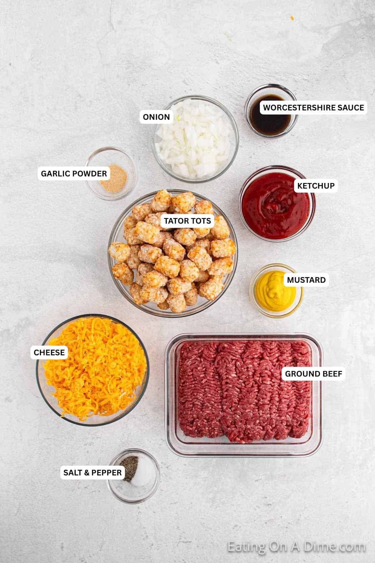 Ingredients needed - ground beef, onion, ketchup, mustard, worcestershire sauce, salt, pepper, garlic powder, tator tots, cheese