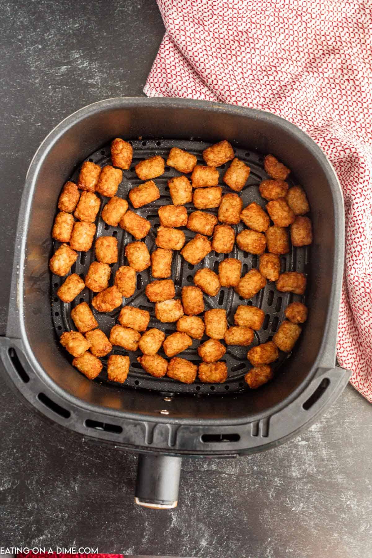 Crispy tator tots in the air fryer basket