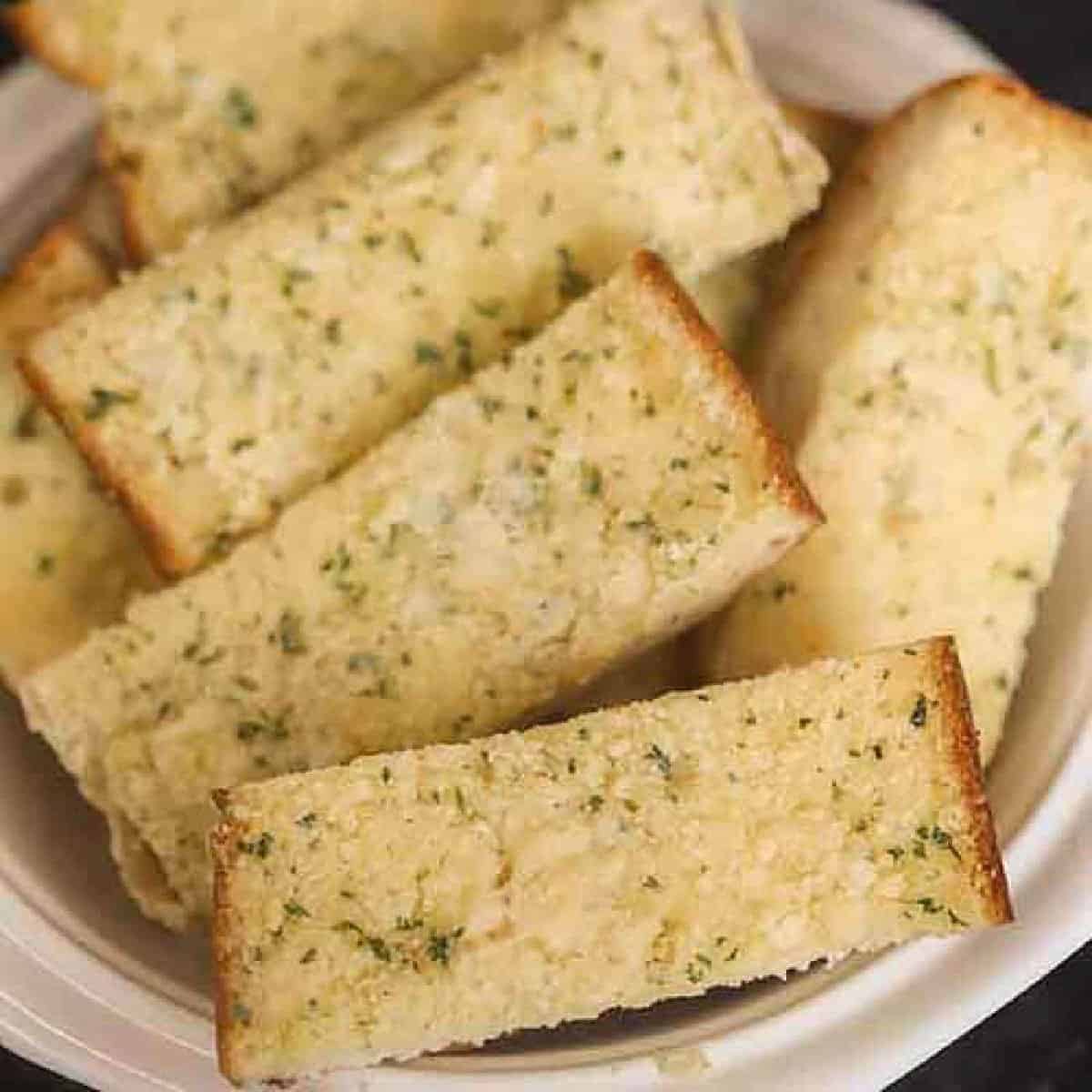 Garlic Bread Slices stacked in a bowl