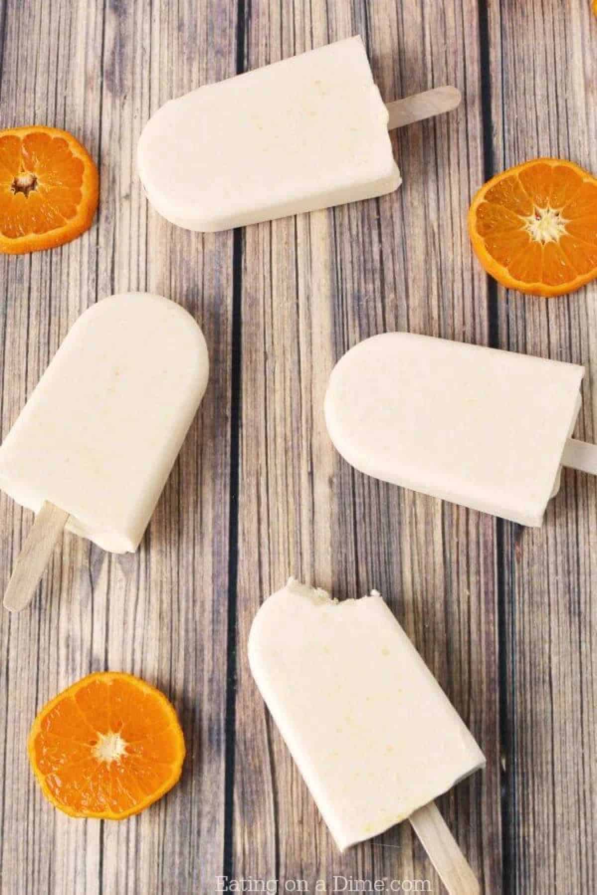 Close up image of orange creamsicle popsicle
