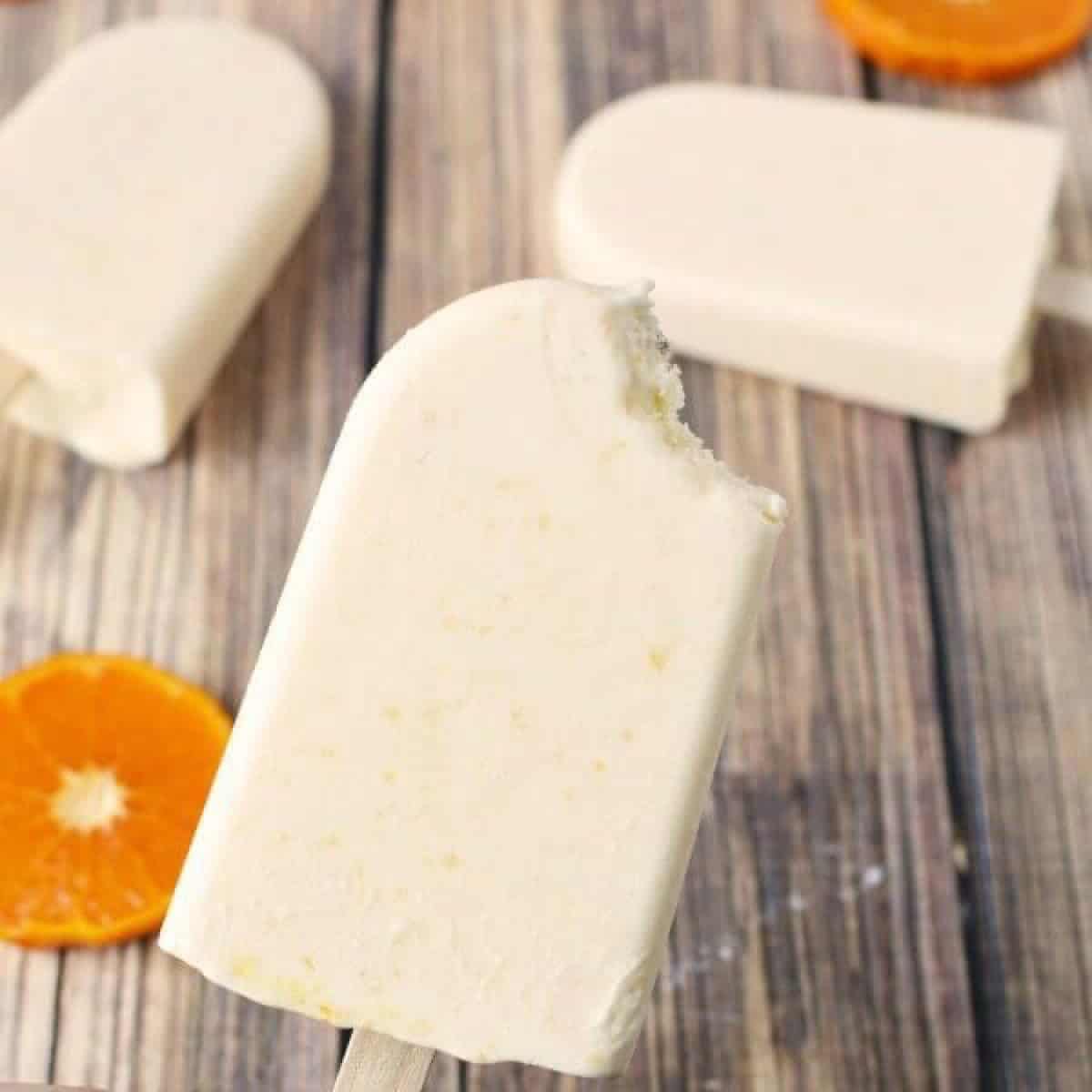 Close up image of orange creamsicle popsicle