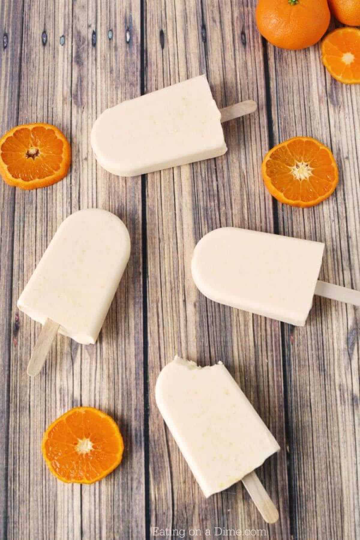 Close up image of orange creamsicle popsicle