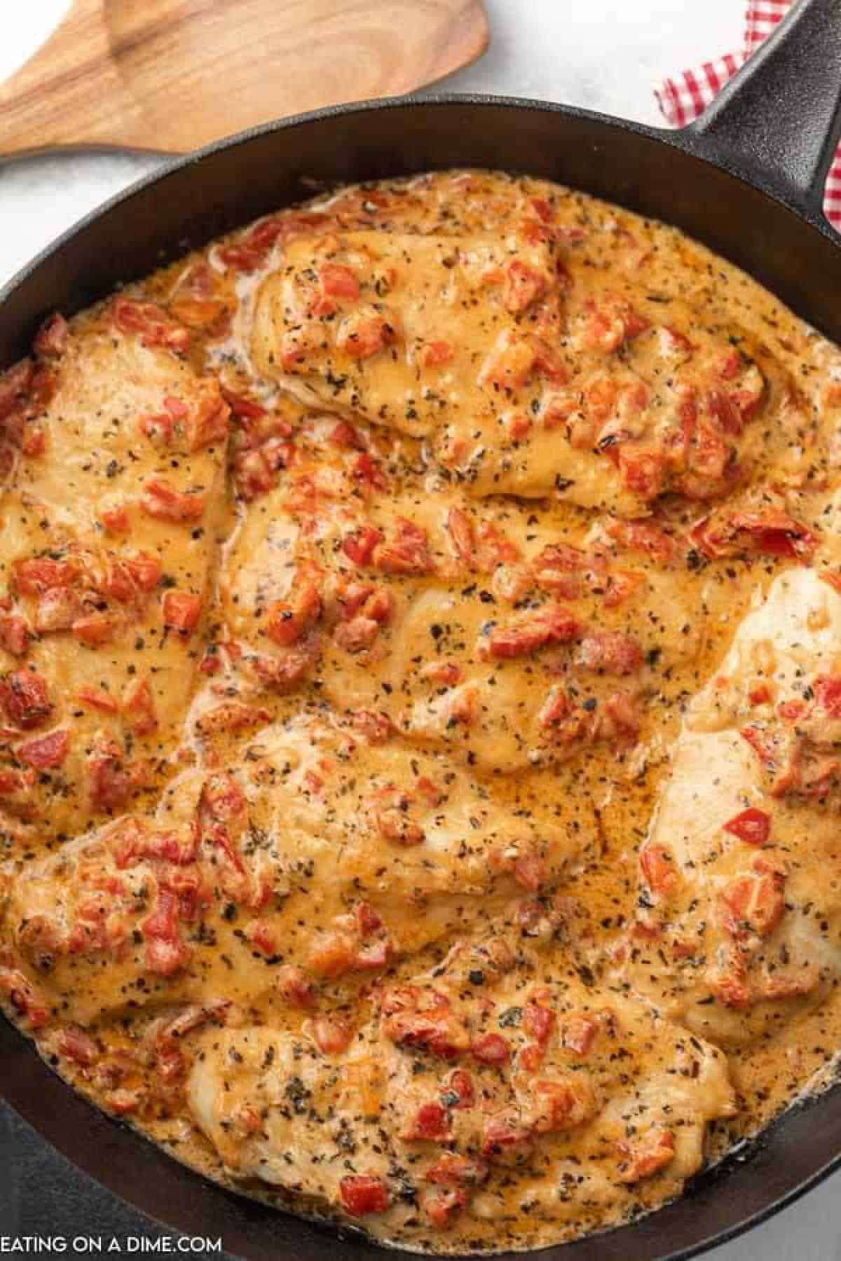 Close up image of roasted red pepper chicken in a skillet 