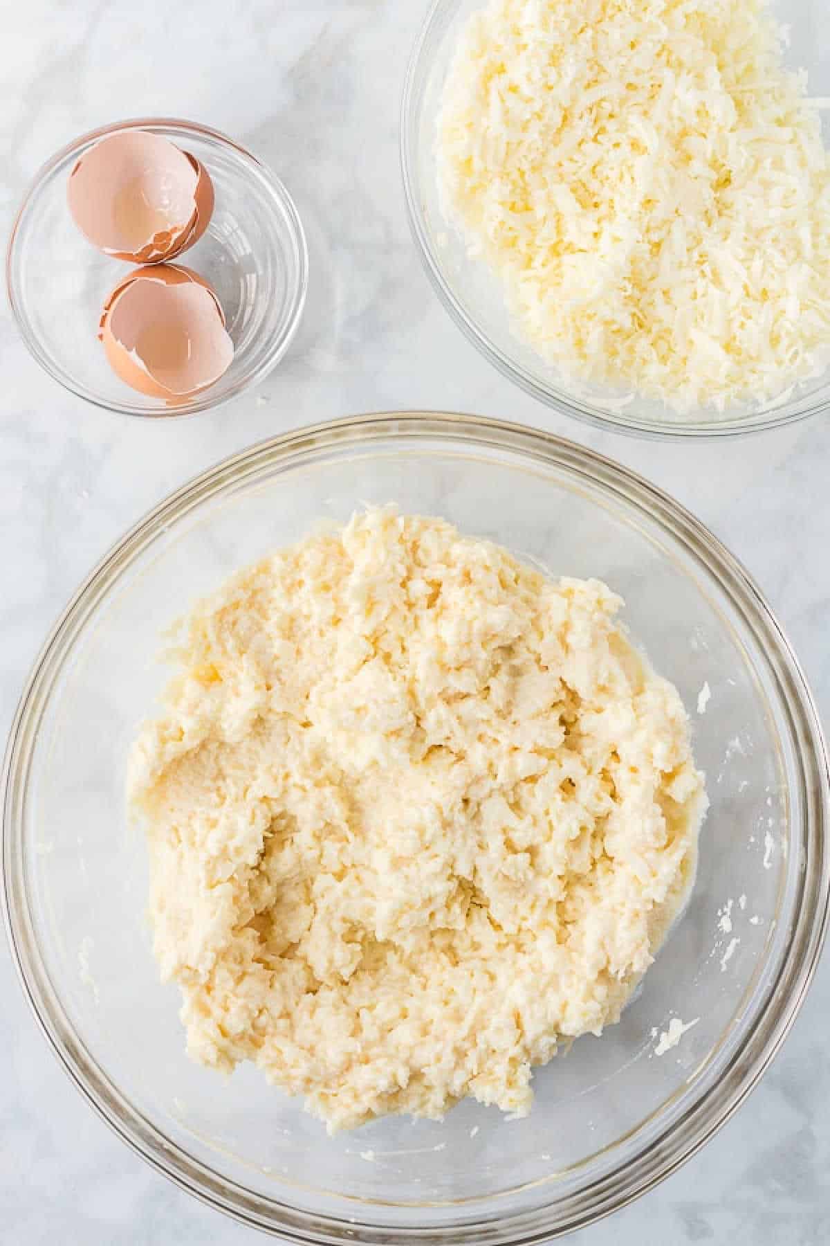 Combining the cheese ingredients in a bowl