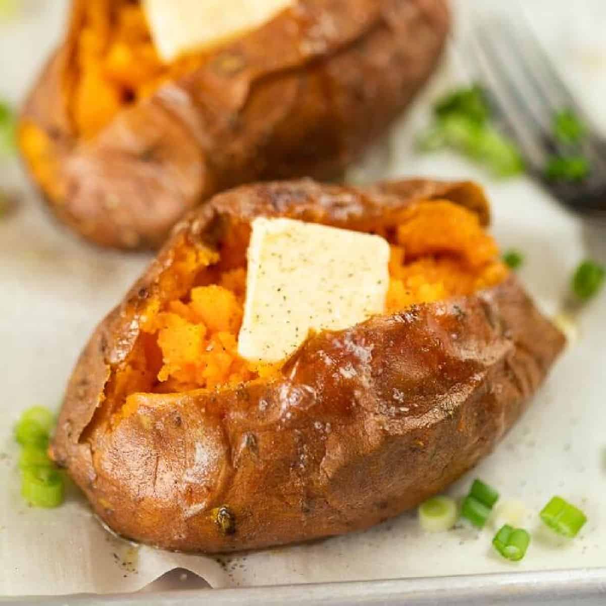 Sweet potatoes topped with butter and chives