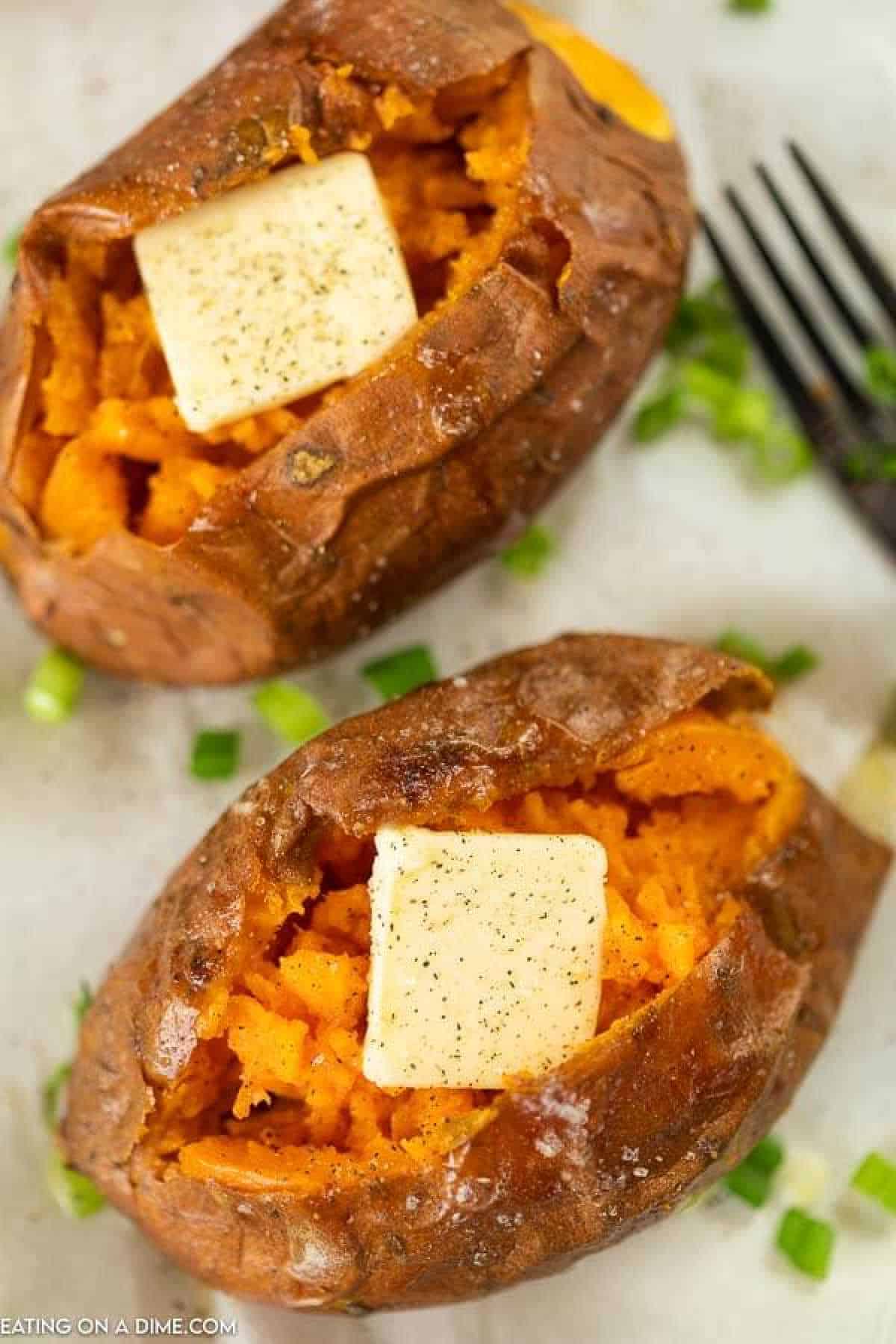 Sweet potatoes topped with butter and green chives