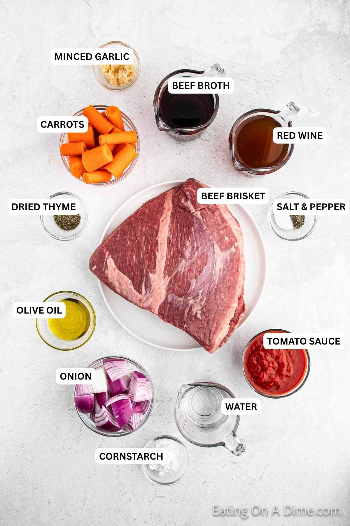 Ingredients for recipe: minced garlic, beef broth, red wine, carrots, dried thyme, beef brisket, salt, pepper, olive oil, tomato sauce, onion, water and cornstarch.