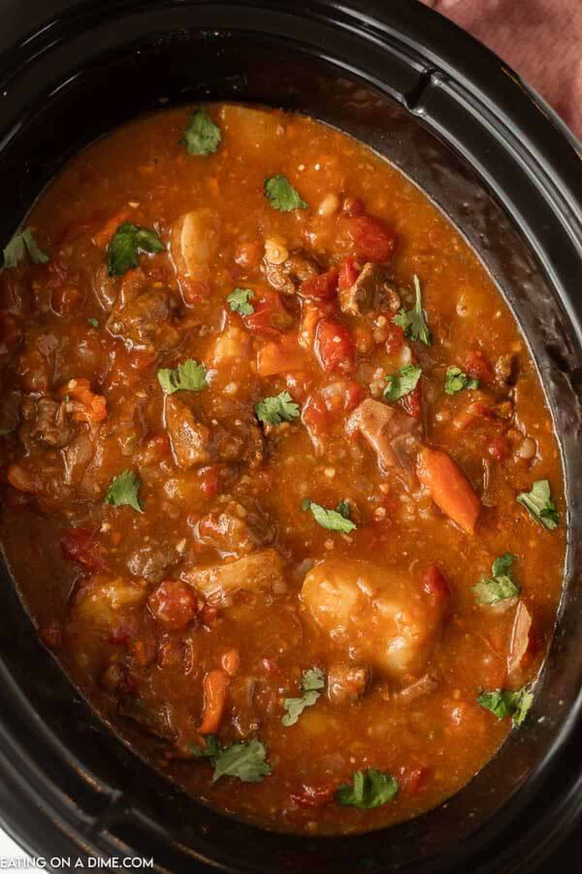 If you are looking for a new stew recipe, this delicious Crock Pot Mexican Beef Stew is the one to try. The tender beef and flavor packed broth taste amazing and even the kids will ask for more veggies! Slow Cooker Mexican Beef Stew is easy to make in the crockpot. #eatingonadime #crockpotmexicanbeefstew #mexicanbeefstewcrockpot Beef Stew in the slow cooker with diced tomatoes, carrots and potatoes