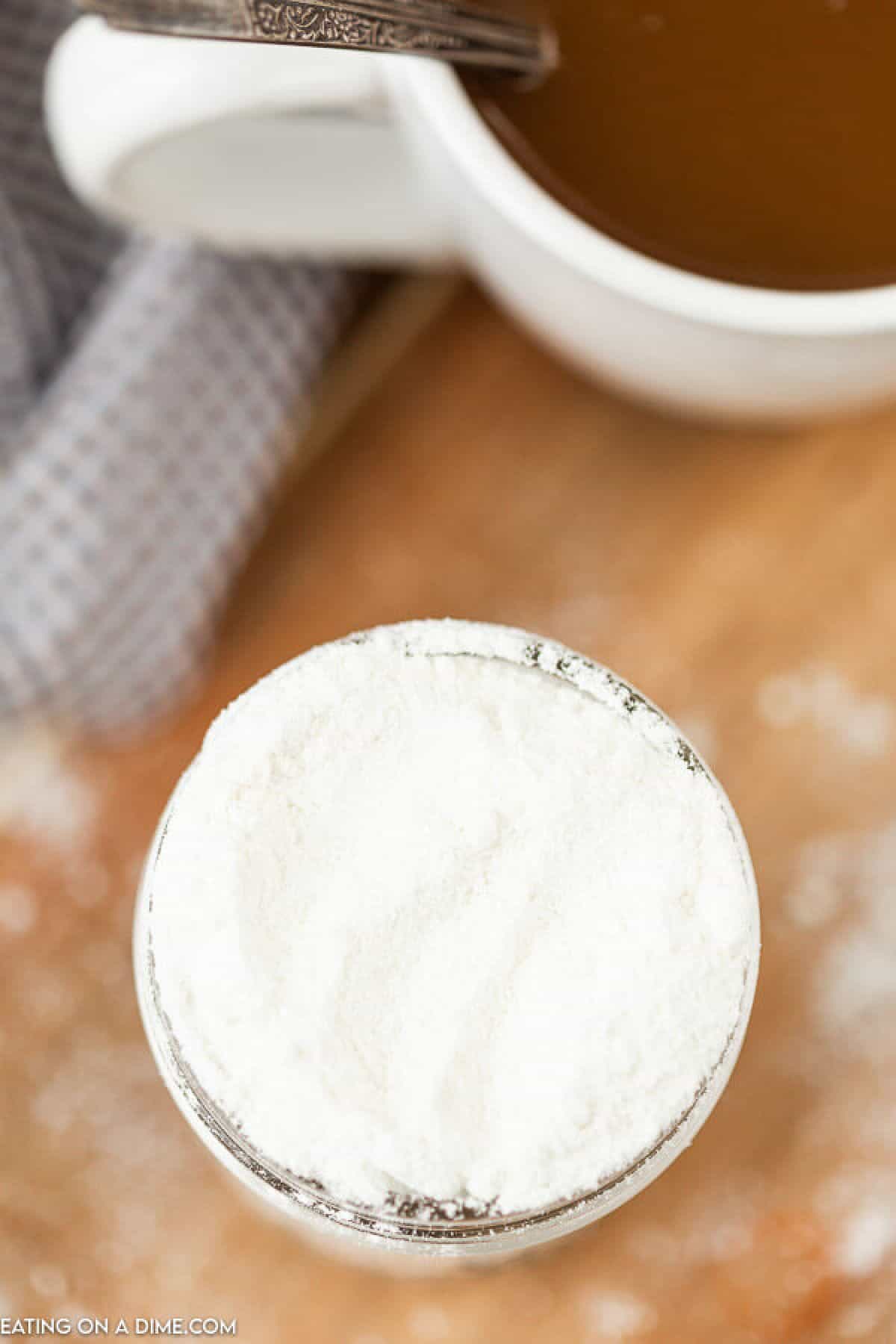 Overhead view of powdered coffee creamer in a jar