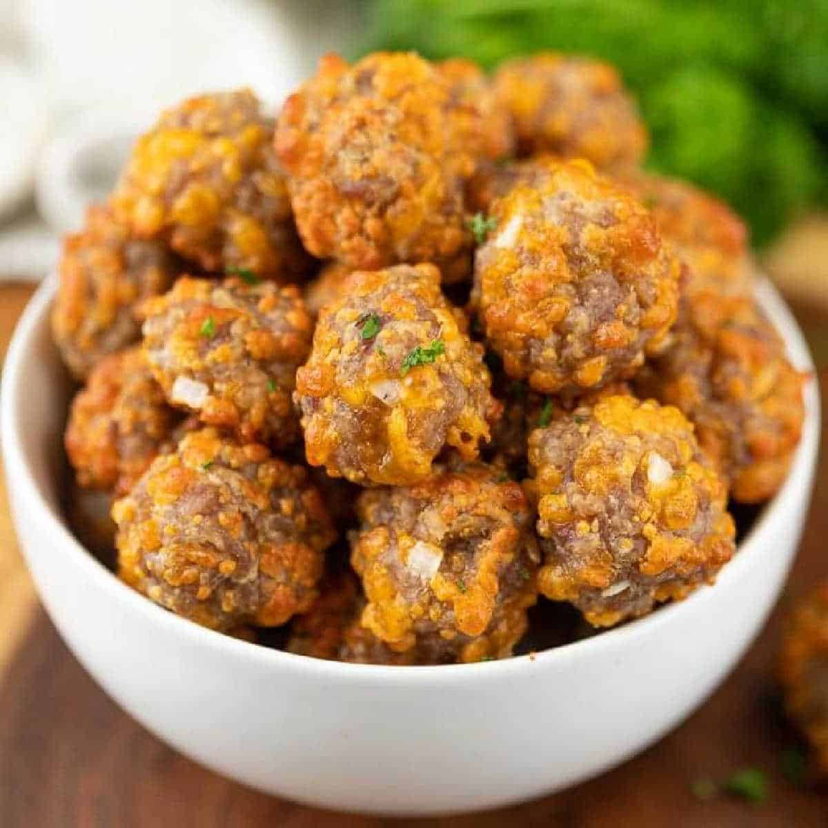 Cooked Sausage balls in a white bowl