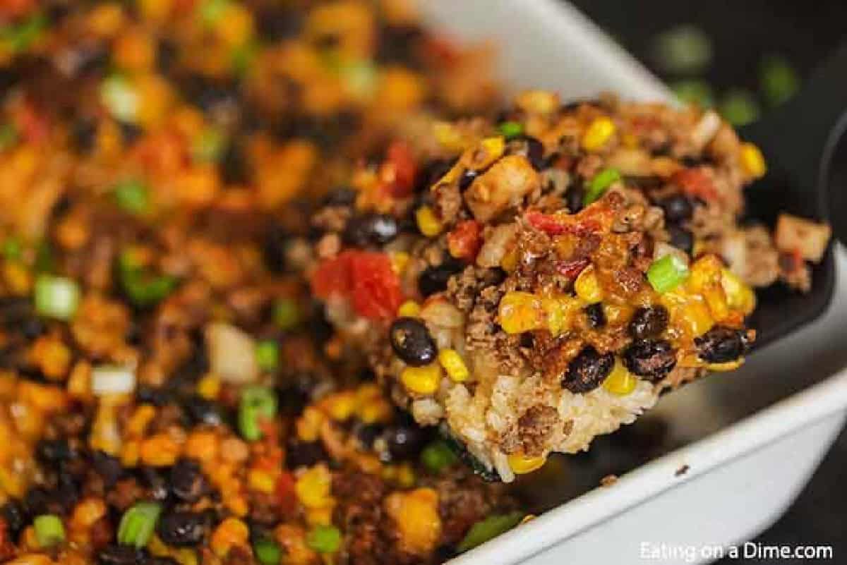 Taco rice casserole is an easy dinner idea and freezer friendly. It is a great recipe to stretch your meat and budget friendly. #eatingonadime #mexicanrecipes #casserolerecipes #recipeseasy #freezermeals