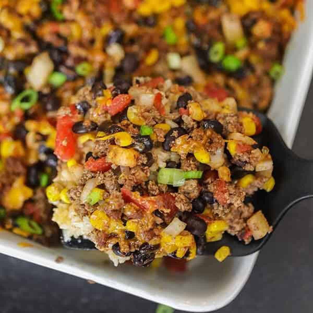 Taco rice casserole is an easy dinner idea and freezer friendly. It is a great recipe to stretch your meat and budget friendly. #eatingonadime #mexicanrecipes #casserolerecipes #recipeseasy #freezermeals