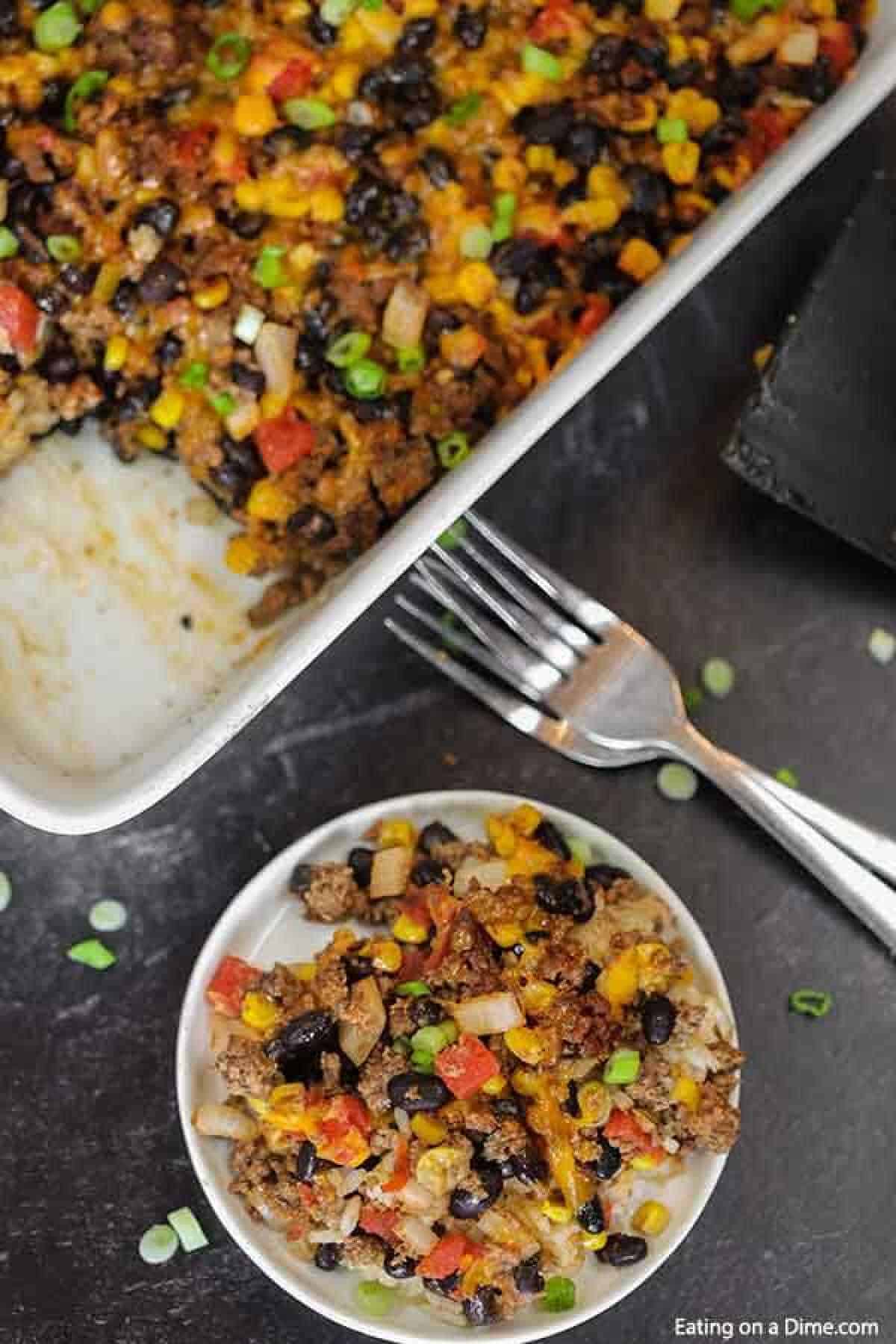 Taco rice casserole is an easy dinner idea and freezer friendly. It is a great recipe to stretch your meat and budget friendly. #eatingonadime #mexicanrecipes #casserolerecipes #recipeseasy #freezermeals