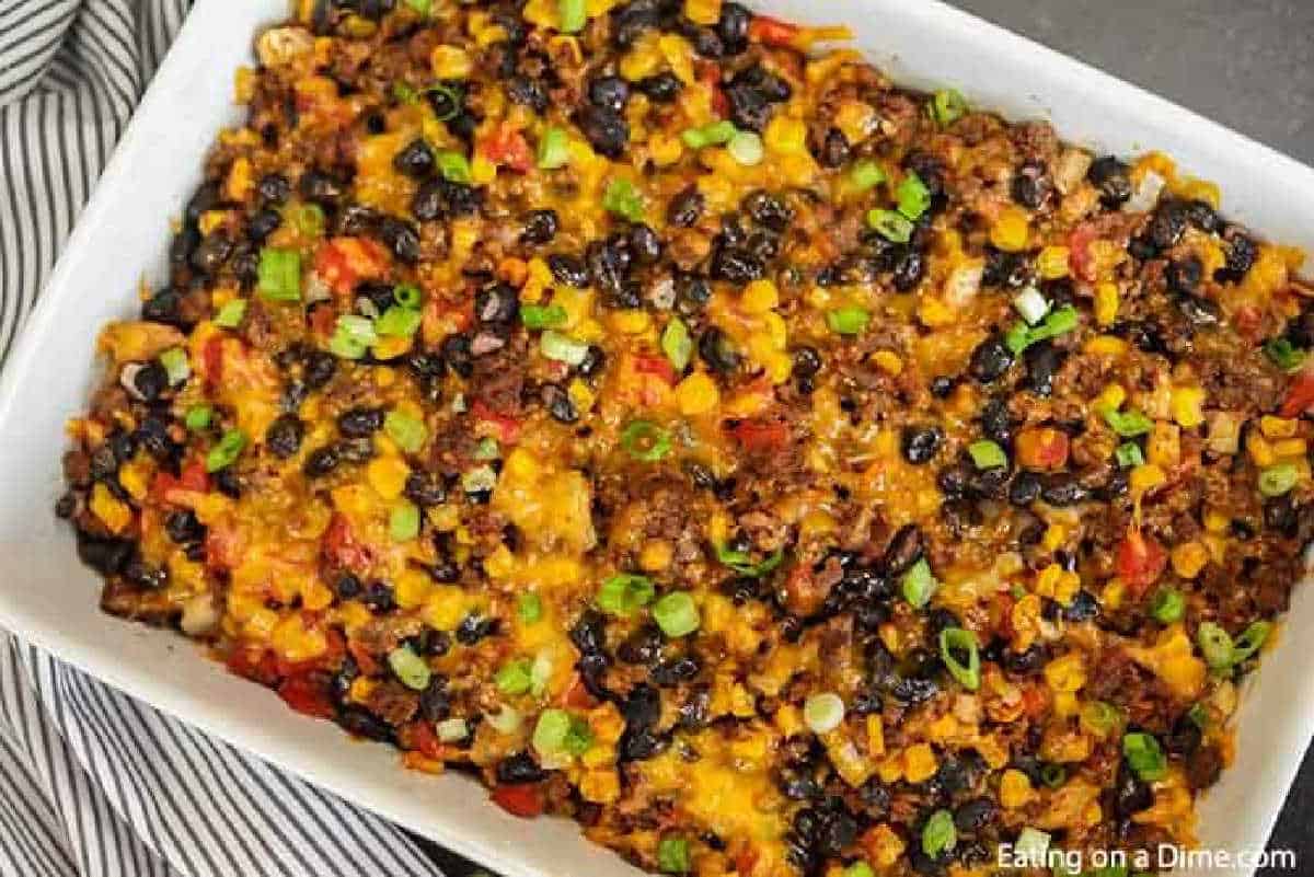 Taco rice casserole is an easy dinner idea and freezer friendly. It is a great recipe to stretch your meat and budget friendly. #eatingonadime #mexicanrecipes #casserolerecipes #recipeseasy #freezermeals