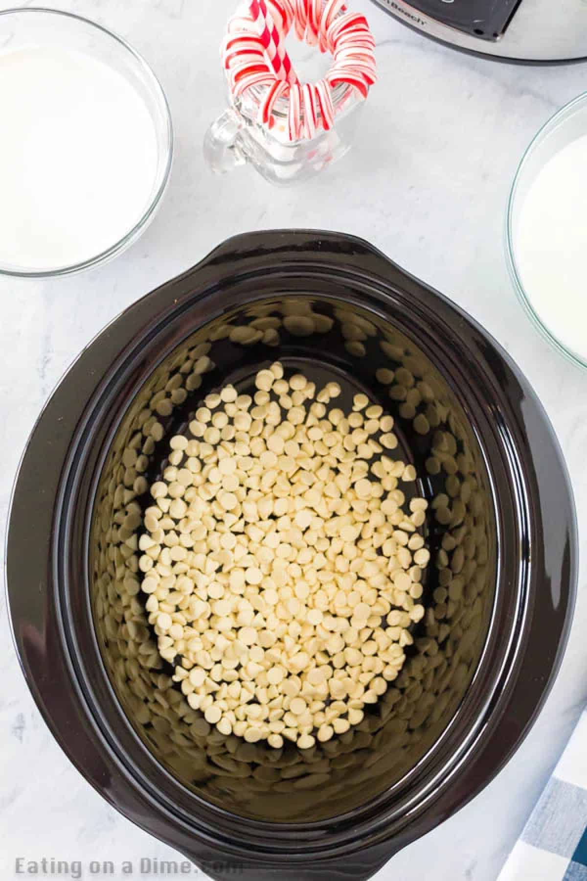 Crock pot white hot chocolate recipe is perfect to serve for a crowd at parties, holidays and more. Keep your hot chocolate warm all night long! Crock pot white hot chocolate recipe is perfect to serve for a crowd at parties, holidays and more. Keep your hot chocolate warm all night long!