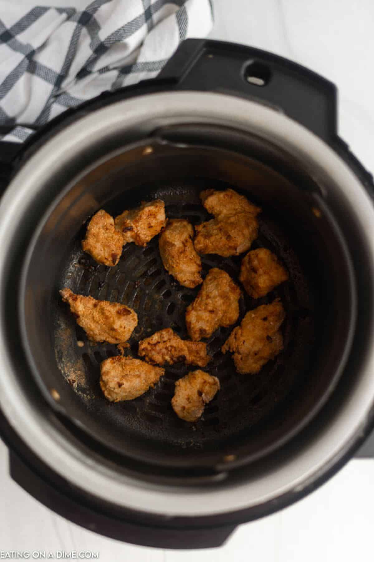 Crispy chicken bites in the air fryer basket