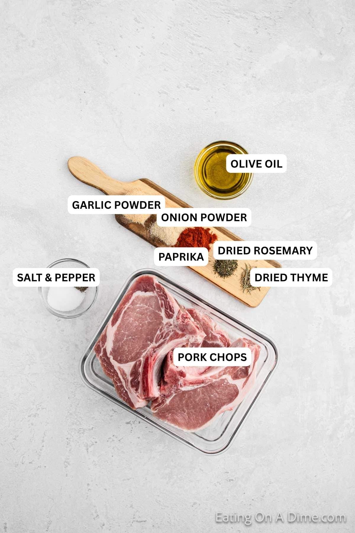 Ingredients for recipe: olive oil, garlic powder, onion powder, paprika, dried rosemary, dried thyme, salt, pepper and pork chops.